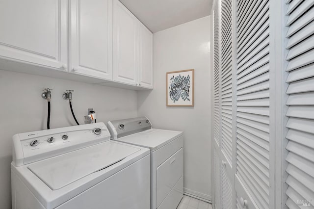 laundry area featuring cabinets and independent washer and dryer