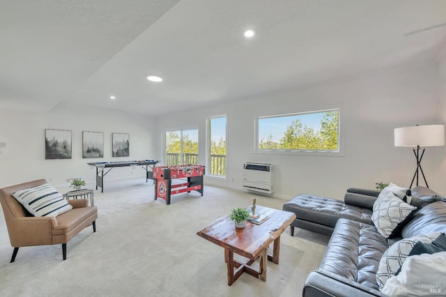 living room with light carpet and heating unit