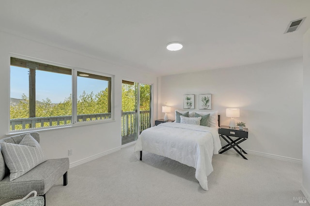 bedroom featuring light carpet