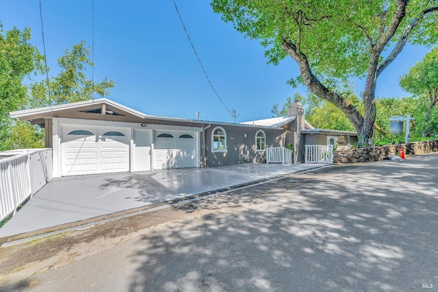 ranch-style house featuring a garage