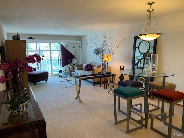 dining room with light carpet