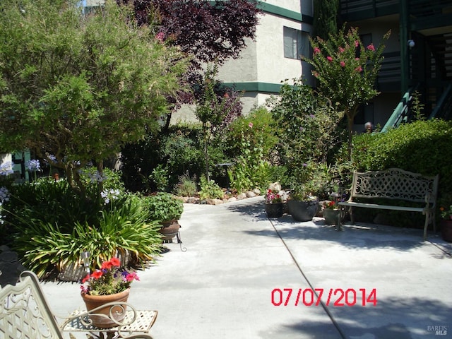 view of home's community with a patio