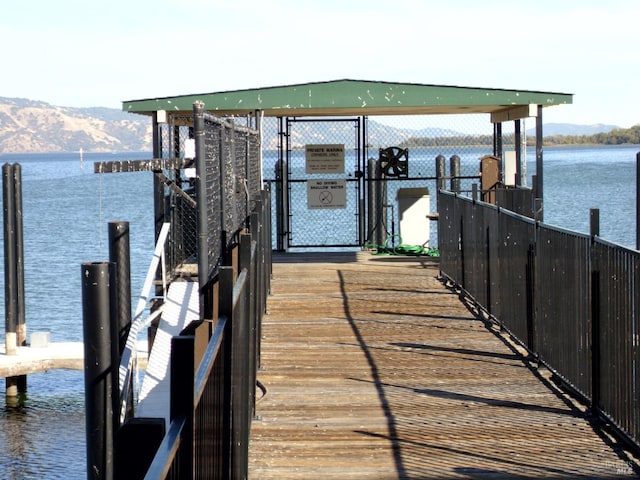 dock area featuring a water and mountain view