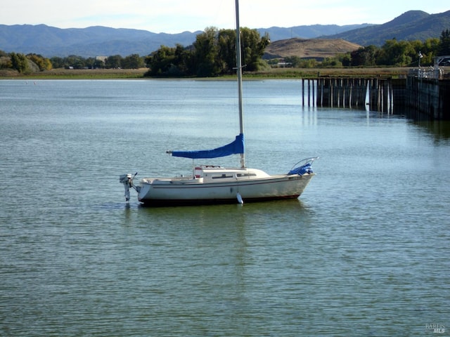 dock area with a water and mountain view