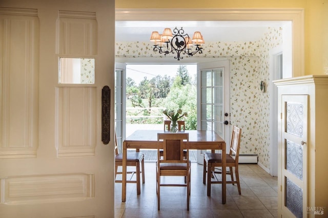 tiled dining room with a baseboard heating unit and a notable chandelier