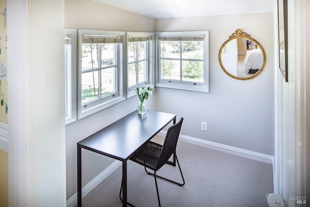 carpeted office space with lofted ceiling