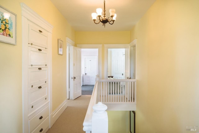 hall featuring light colored carpet