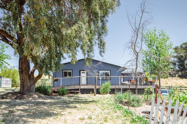 back of property featuring a deck