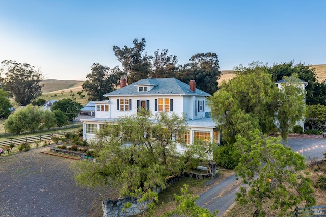 view of front of property with a rural view