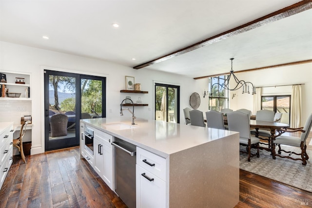 kitchen with a sink, dark wood finished floors, open shelves, light countertops, and appliances with stainless steel finishes