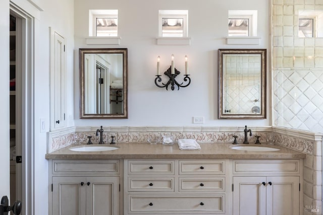 bathroom with double vanity and a sink