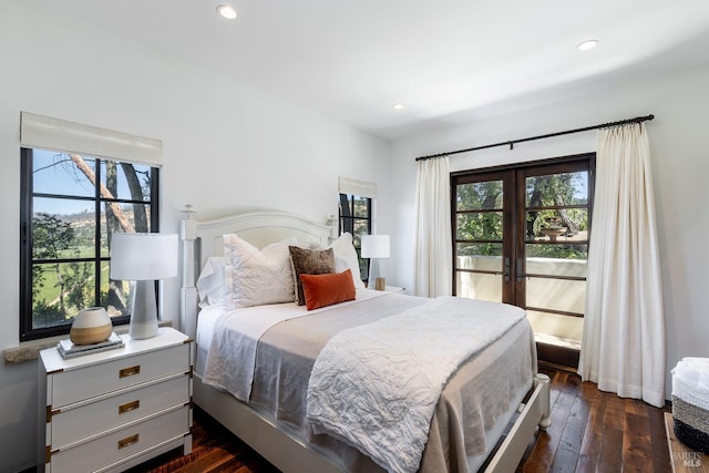 bedroom with french doors, recessed lighting, and dark wood finished floors