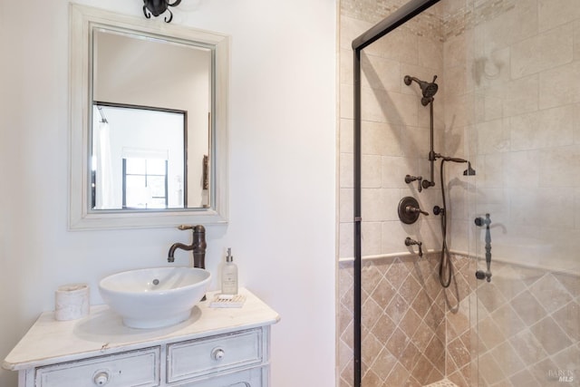full bathroom featuring a shower stall and vanity