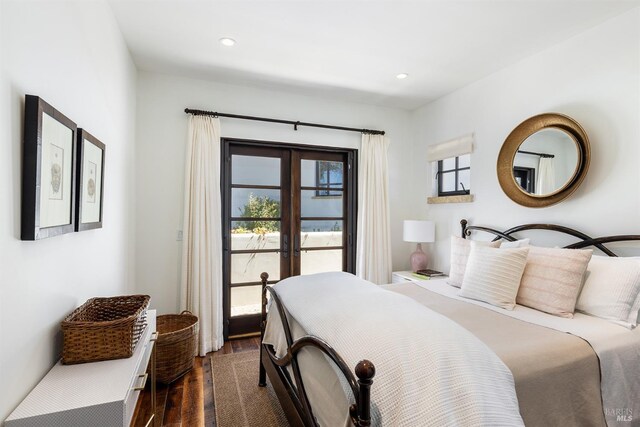 bedroom with french doors, recessed lighting, access to exterior, and dark wood-style flooring