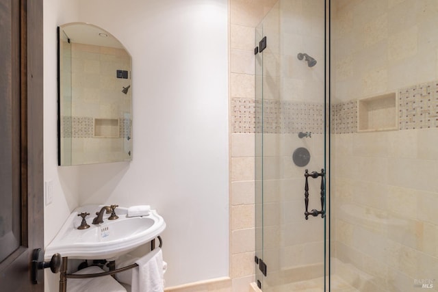 full bath with a shower stall