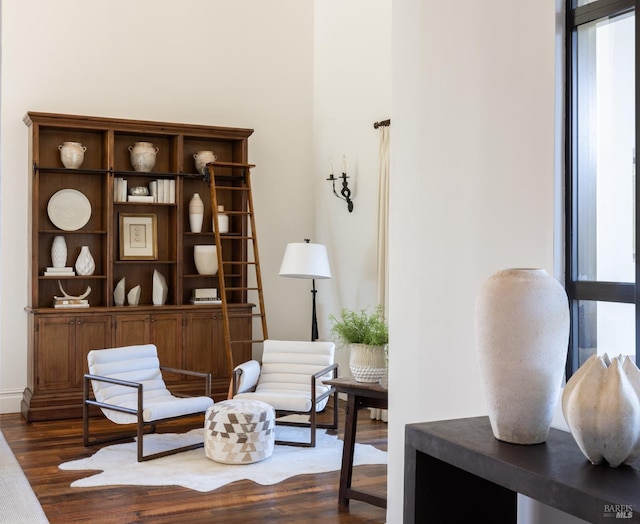 sitting room with dark wood finished floors