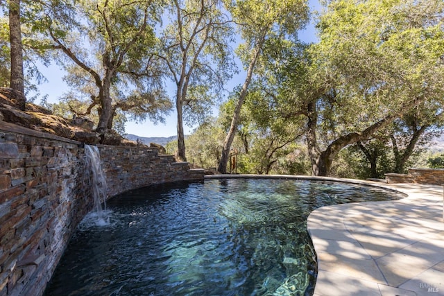 outdoor pool featuring a patio area