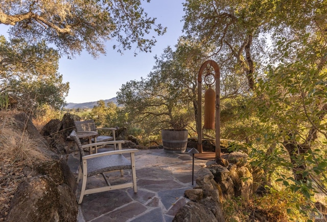 view of patio / terrace with a mountain view