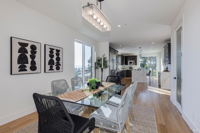 dining space with light wood-type flooring