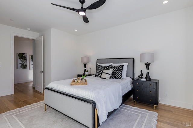 bedroom with hardwood / wood-style flooring and ceiling fan