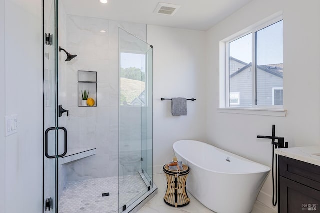 bathroom featuring vanity and plus walk in shower