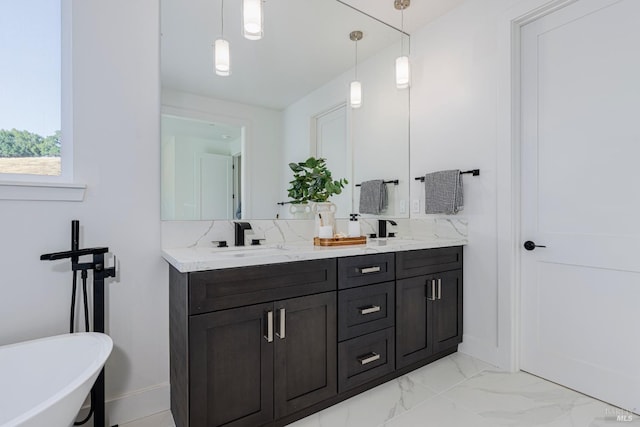 bathroom featuring vanity and a tub to relax in