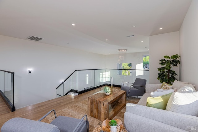 living room with light hardwood / wood-style flooring