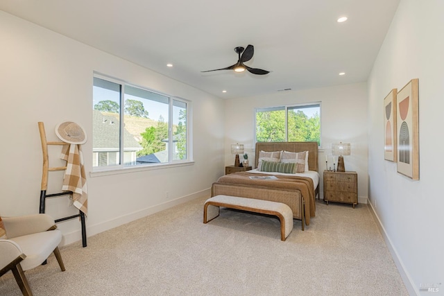 bedroom with light colored carpet and ceiling fan