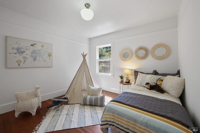 bedroom featuring dark hardwood / wood-style flooring