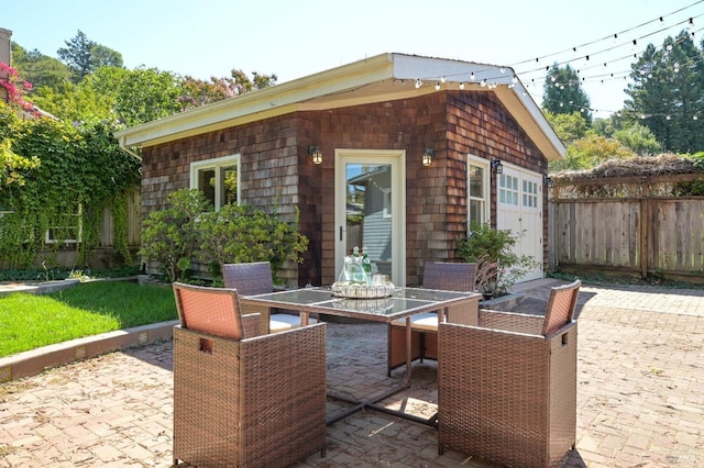 view of patio / terrace featuring outdoor dining space and fence