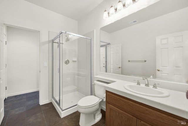 bathroom featuring vanity, toilet, tile patterned floors, and a shower with door