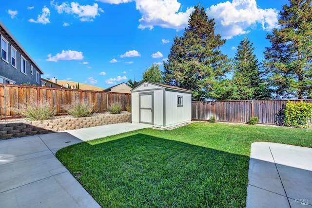 view of yard featuring a storage shed and a patio area