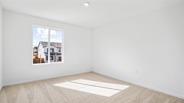 unfurnished room with carpet flooring