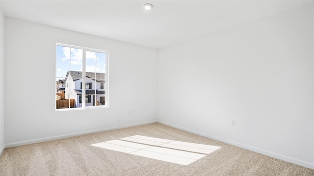 unfurnished room with carpet floors