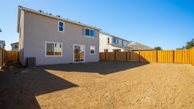 rear view of property featuring central AC unit