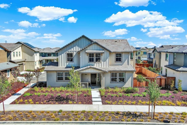 2464 Lake Club Dr, Fairfield, CA 94533 - view of front of property with a residential view, a tile roof, stucco siding, and fence