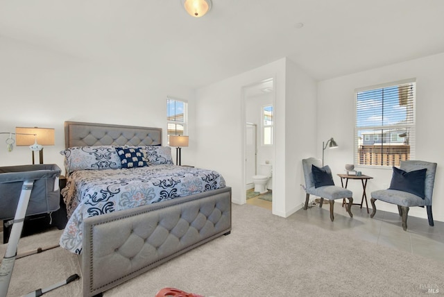 carpeted bedroom featuring ensuite bathroom