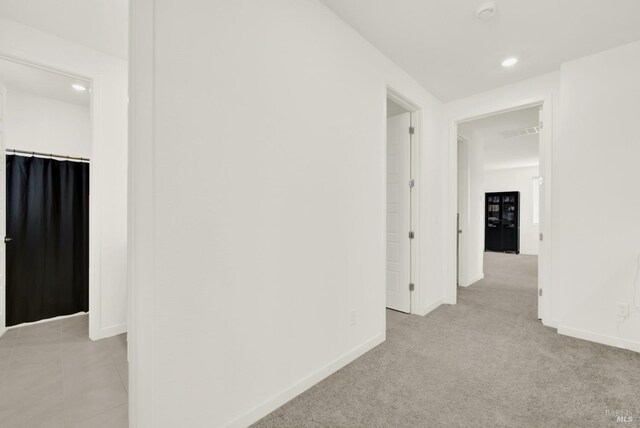 2464 Lake Club Dr, Fairfield, CA 94533 - hall featuring light carpet, baseboards, visible vents, and recessed lighting