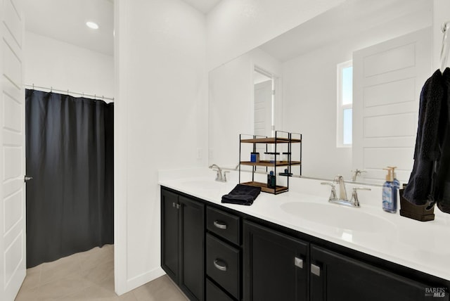 2464 Lake Club Dr, Fairfield, CA 94533 - bathroom with double vanity, a sink, tile patterned floors, and recessed lighting