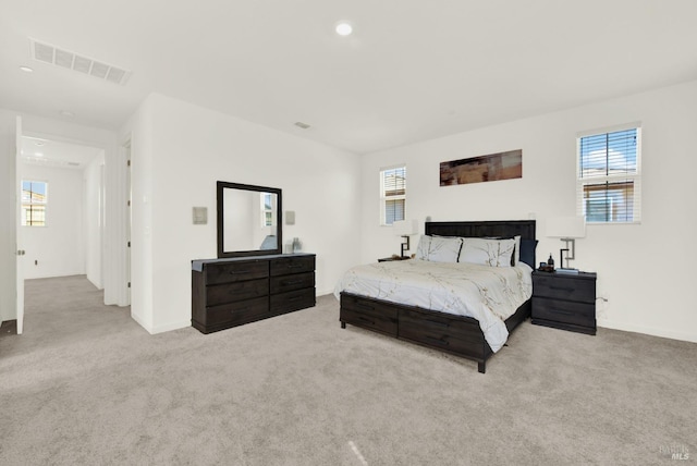 bedroom featuring light carpet