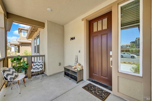 property entrance featuring covered porch