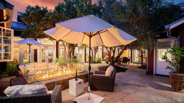 patio terrace at dusk with an outdoor living space