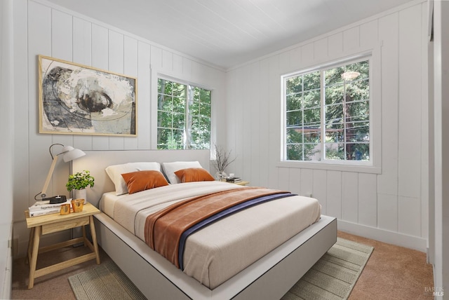 bedroom featuring light colored carpet