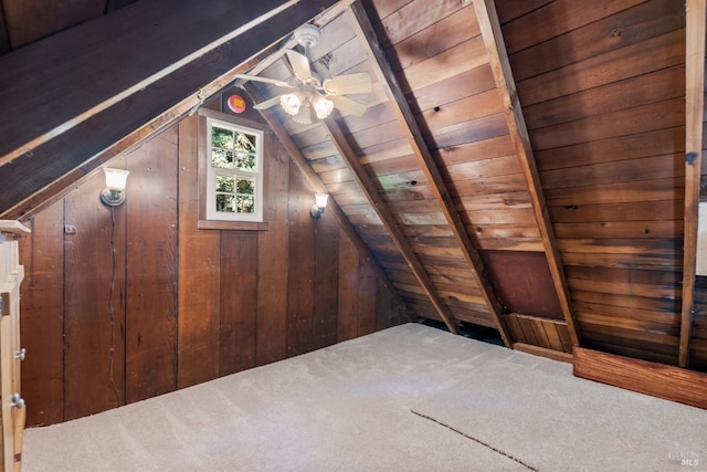 bonus room with wooden ceiling, lofted ceiling, carpet flooring, and wood walls