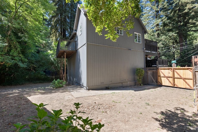 rear view of property with a balcony