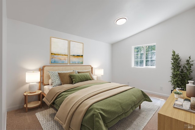 carpeted bedroom with vaulted ceiling