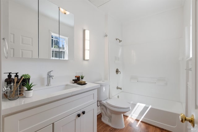 full bathroom with vanity, wood-type flooring, shower / bathtub combination, and toilet