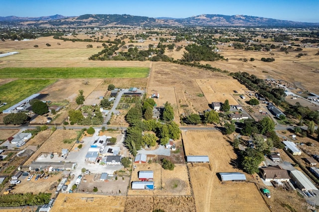 birds eye view of property featuring a rural view and a mountain view