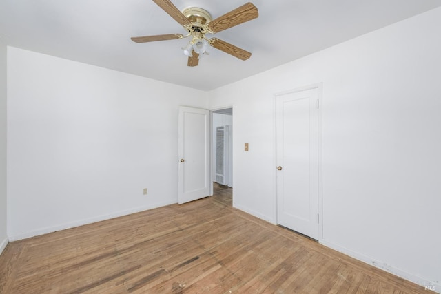 unfurnished bedroom with ceiling fan and light hardwood / wood-style flooring