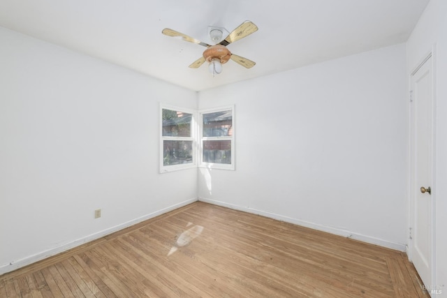 empty room featuring light hardwood / wood-style flooring and ceiling fan